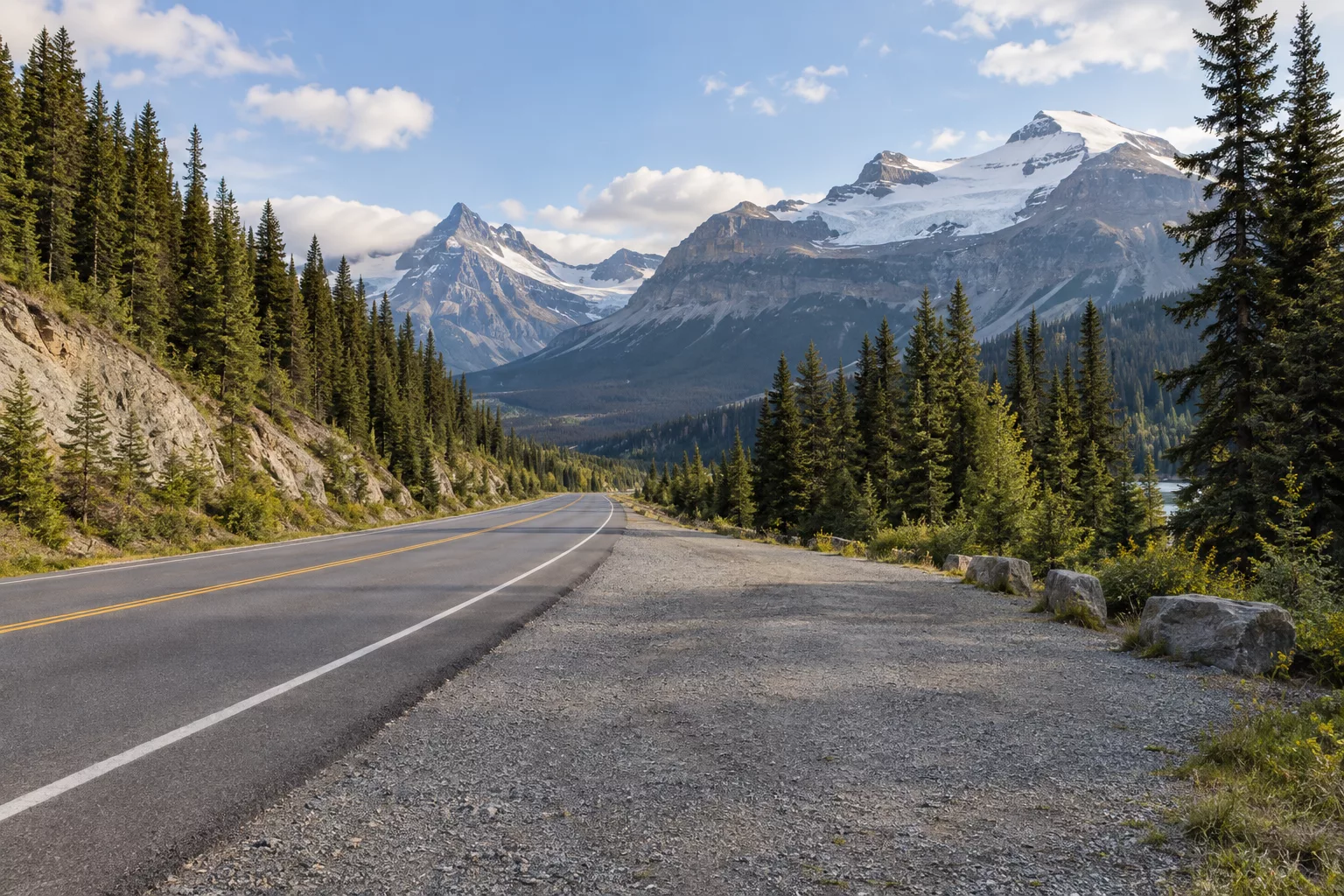 Safe roadside pullout on the Icefields Parkway with mountain road conditions visible